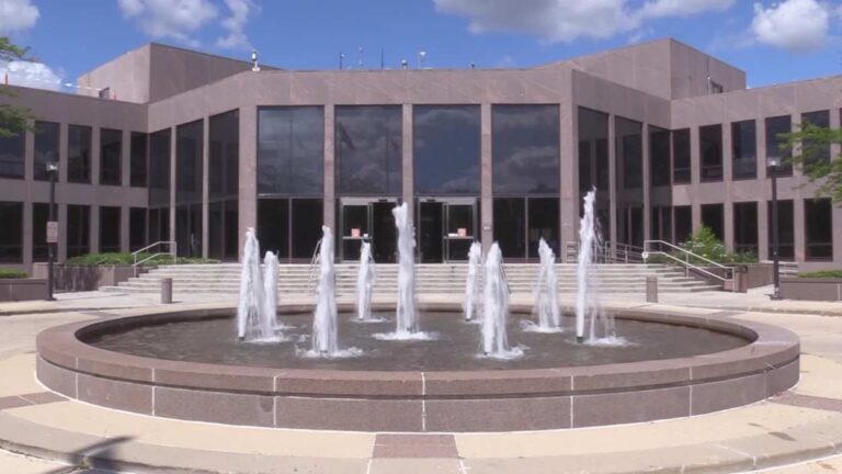 Exterior image of Naperville City Hall with fountain in foreground