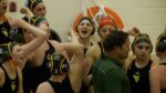 Waubonsie Valley girls water polo cheers during matchup against Lockport.