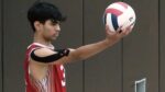 Naperville Central boys volleyball player serves in against Metea.