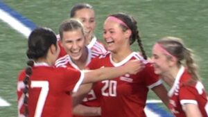 Naperville Central girls soccer players celebrates Emerson Burkes goal against Neuqua.