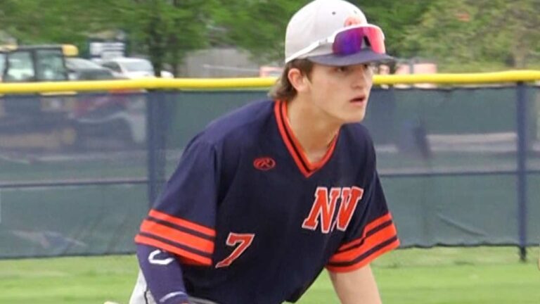 Naperville North baseball player fields a grounder before playing Metea Valley.