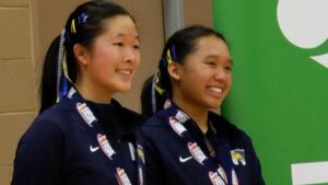 Luna Han and Kanyanat Vajworarat smile with the state medals.
