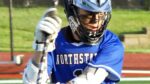 St. Charles North lacrosse player warms up before the game.
