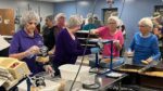 Naperville Woman's Club volunteers pack meals for Feed My Starving Children.