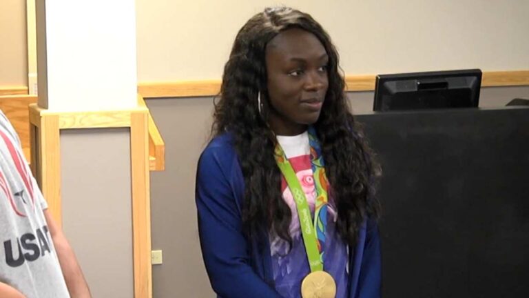 2024 Olympic track Morolake Akinosun with gold medal