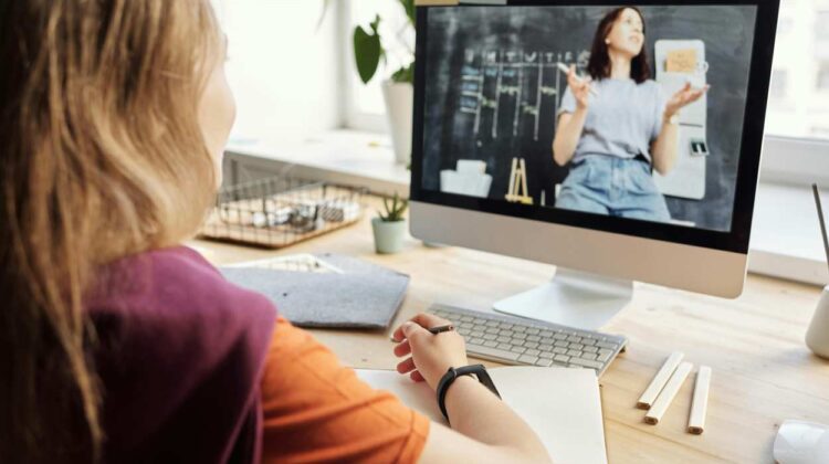 child in front of computer doing e-learning