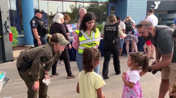 national night out from 2023, girl interacting with officer