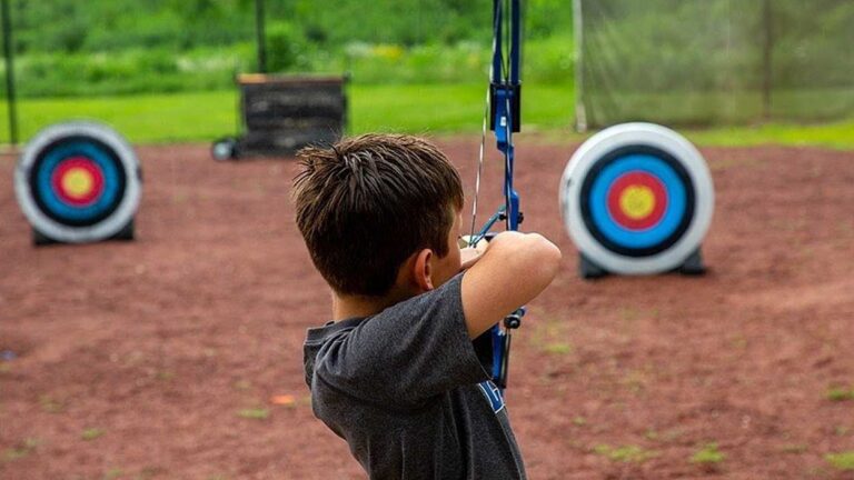Kid takes aim at target at archery course at Blackwell Forest Preserve