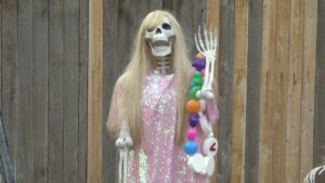 Taylor Swift skeleton with raised arm