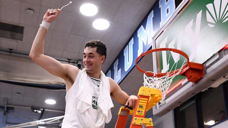 John Poulakidas cuts down the nets for Yale Basketball after winning the Ivy League Conference Tournament. He recently signed a Summer League contract with the Los Angeles Clippers.
