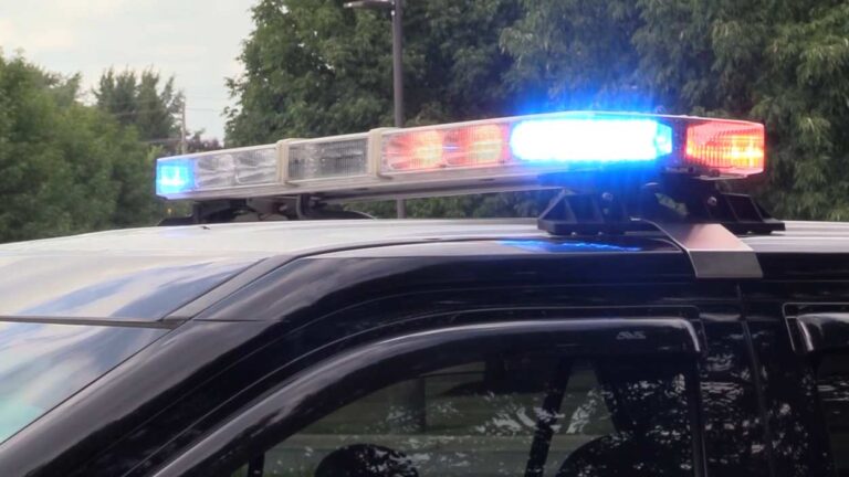Naperville police car lights turned on.
