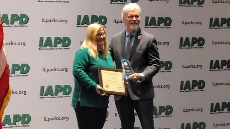Park Board Vice President Leslie Ruffing receiving the Master Board Member Award at park board conference