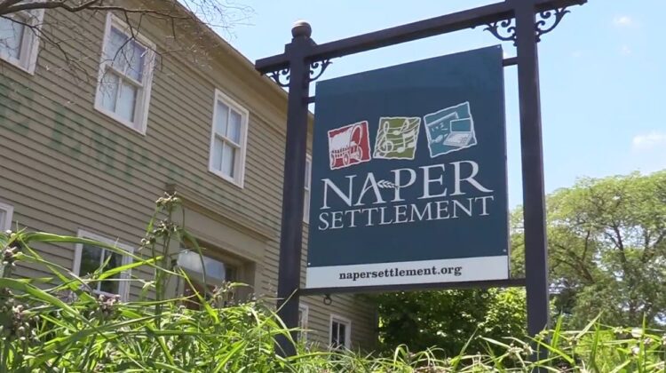 Low angle shot of Naper Settlement sign