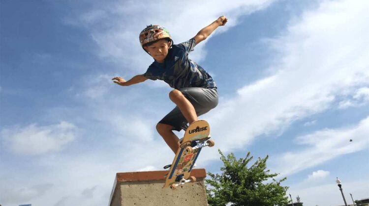 Picture of Max in the air on his skateboard