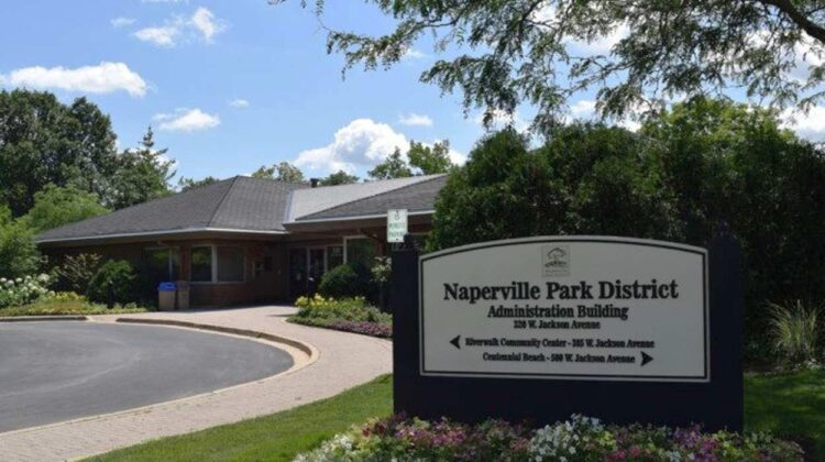 Wide shot of Naperville Park District Administration Building with sign for the building in foreground for story on financial roadmap for district