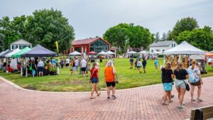Shoppers browse Naper Settlement Farmers Market, wide shot