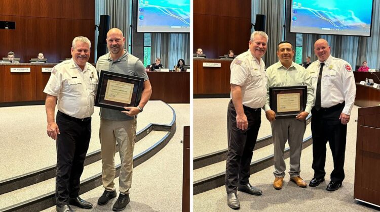Naperville fire chief stands with life-saving heroes honored at city council meeting - each hero holding a plaque of recognition