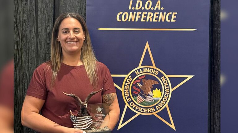 Forest Preserve District of DuPage County police officer Kim Eversole with her award
