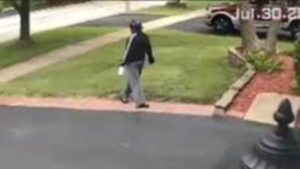 Back image of missing woman Sinmi Abosede walking away from house