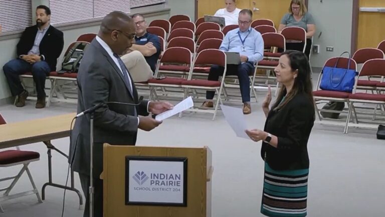 IPSD 204 Superintendent Dr Adrian Talley swears in Natasha Grover at board meeting