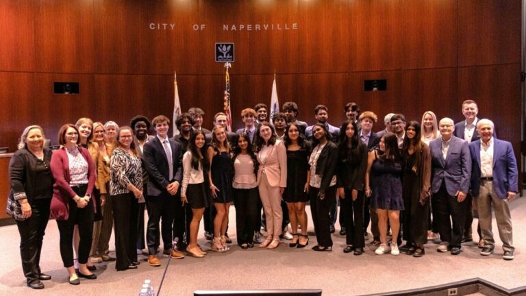 KidsMatter Teen Philanthopy Initiative students in council chambers posing for photo