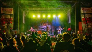 A band performs on stage at Naper Settlement